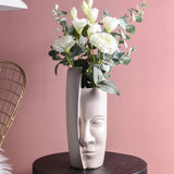 Művészi vázák arccal